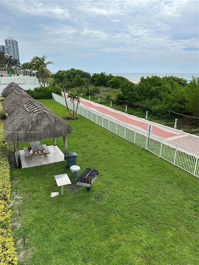 view of yard featuring a gazebo and a water view