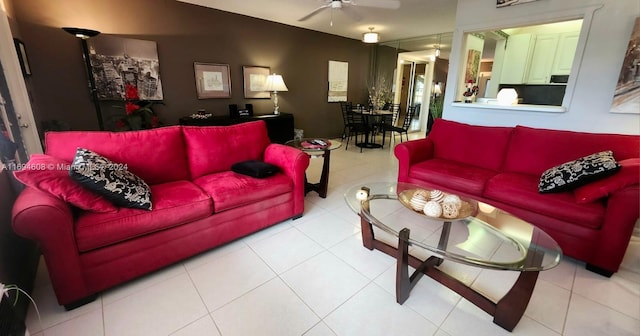 tiled living room featuring ceiling fan