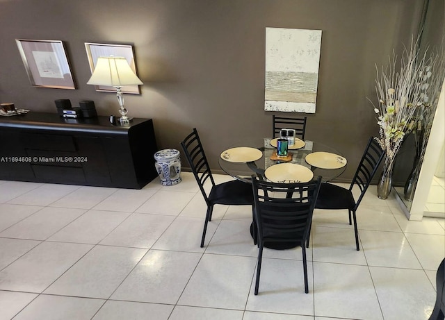 dining area featuring light tile patterned floors