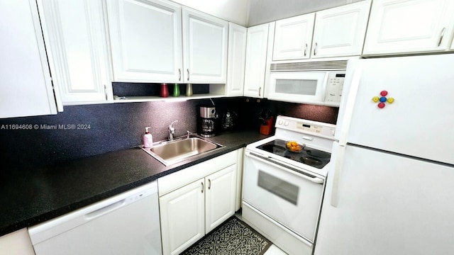 kitchen featuring white cabinets, decorative backsplash, white appliances, and sink