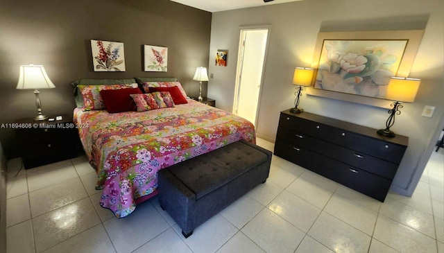 bedroom with light tile patterned flooring