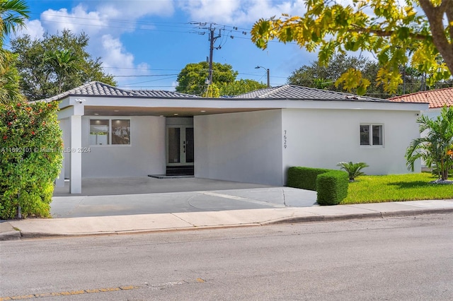 view of front of home with a carport