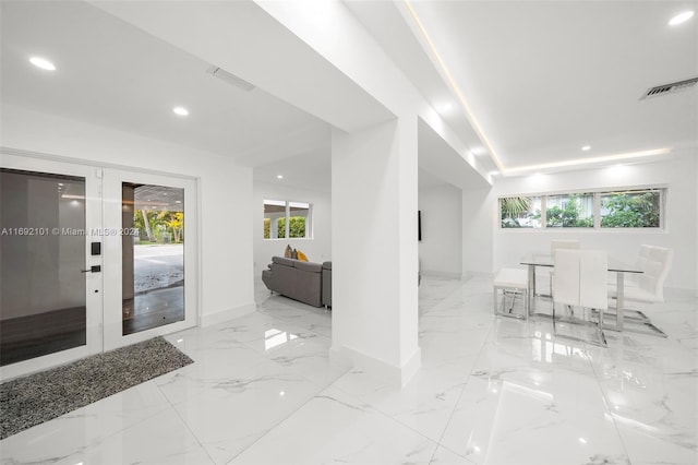 foyer entrance featuring french doors