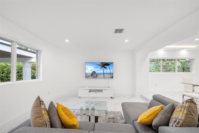 living room featuring plenty of natural light