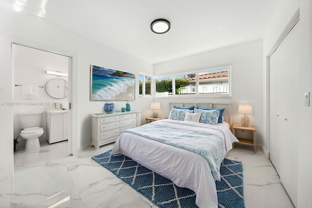 bedroom with a closet and sink