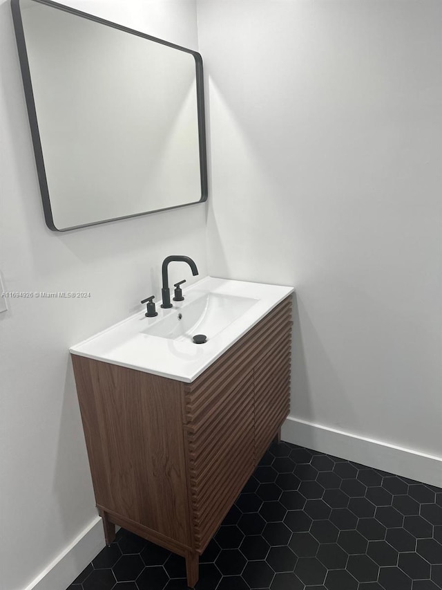 bathroom with vanity and tile patterned floors