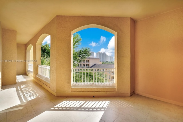 doorway with light tile patterned flooring