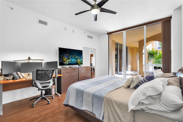 bedroom featuring ceiling fan, floor to ceiling windows, access to exterior, and wood-type flooring