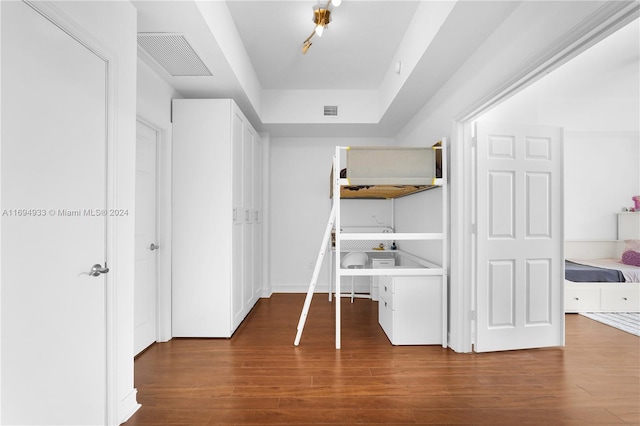 hallway with hardwood / wood-style floors