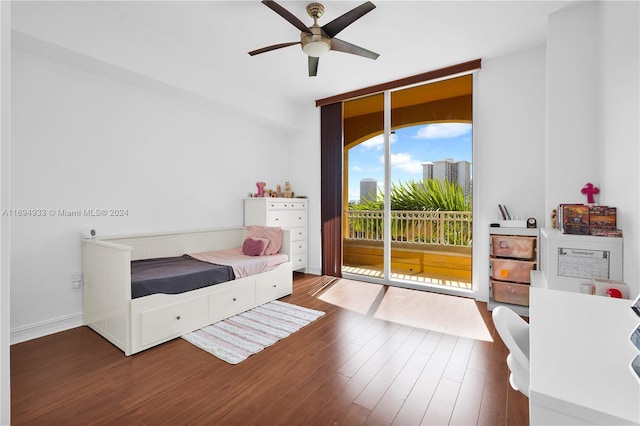 bedroom with access to outside, ceiling fan, and dark hardwood / wood-style floors