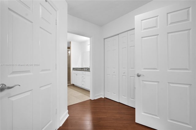 hall with dark wood-type flooring