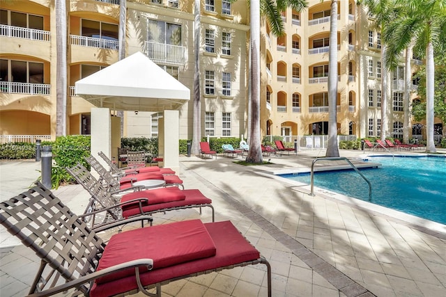 view of swimming pool with a patio area