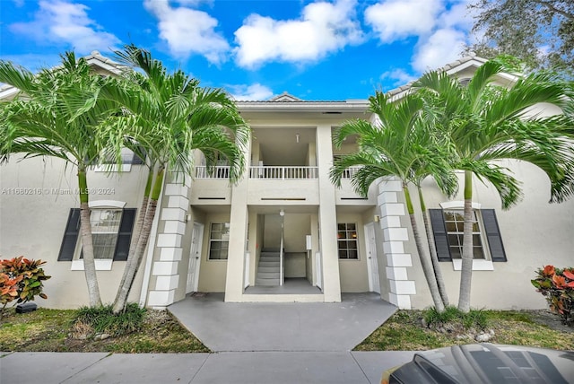 entrance to property with a balcony