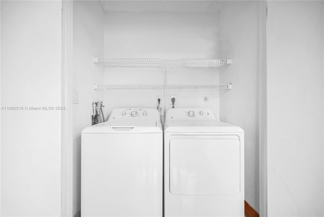 clothes washing area featuring washer and dryer