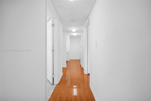 corridor with light tile patterned flooring