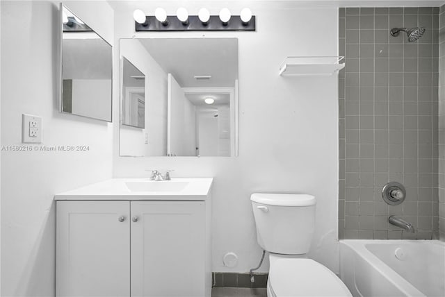 full bathroom with vanity, toilet, and tiled shower / bath