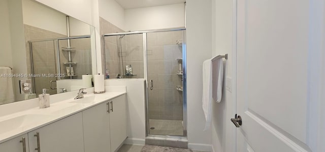 bathroom with an enclosed shower and vanity