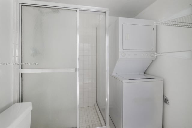 laundry area featuring stacked washer and clothes dryer