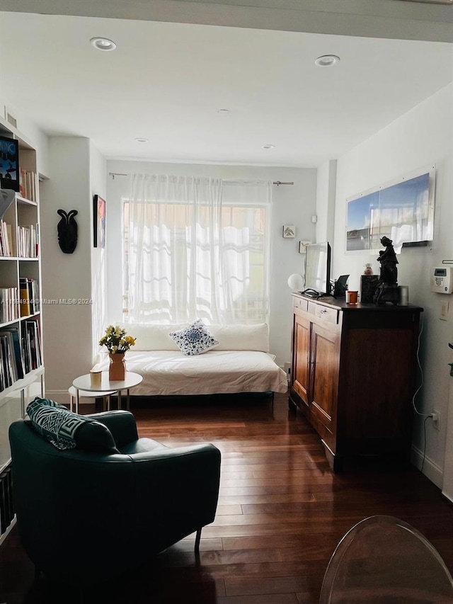 sitting room with dark hardwood / wood-style flooring