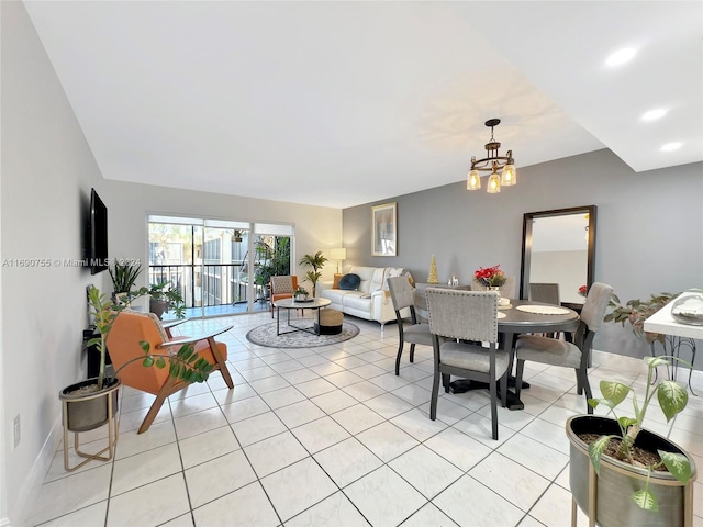 tiled dining room with a notable chandelier