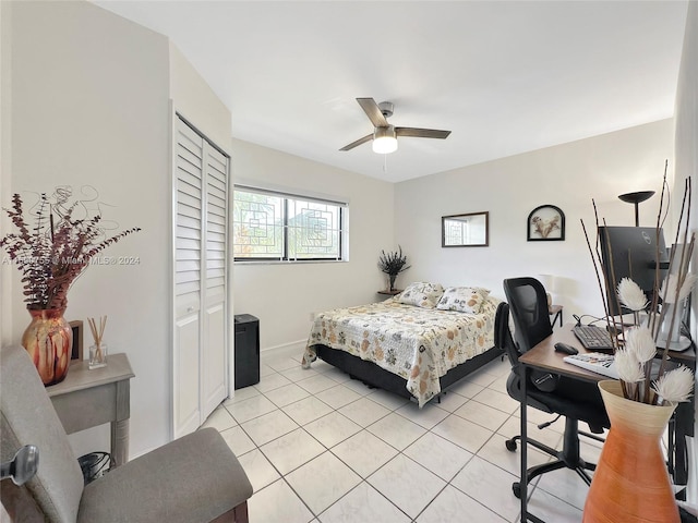 bedroom with ceiling fan and light tile patterned floors