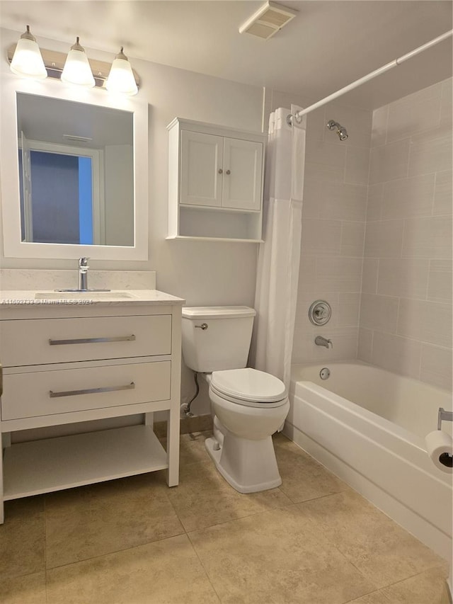 full bathroom with tile patterned floors, shower / bath combo, toilet, and vanity