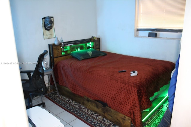 bedroom with light tile patterned floors