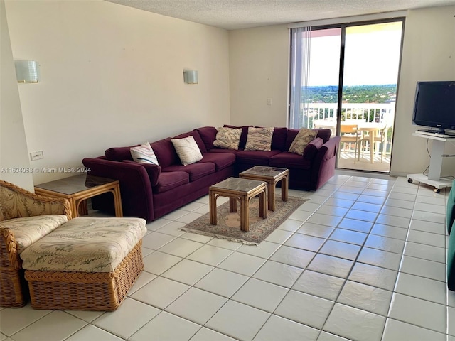 1500 S Ocean Dr Unit 17E, Hollywood, FL 33019 - living area featuring a textured ceiling and light tile patterned floors