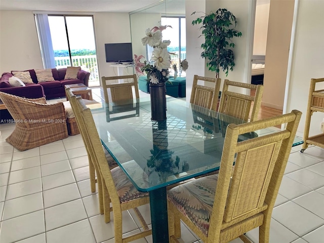 dining room with plenty of natural light and light tile patterned floors