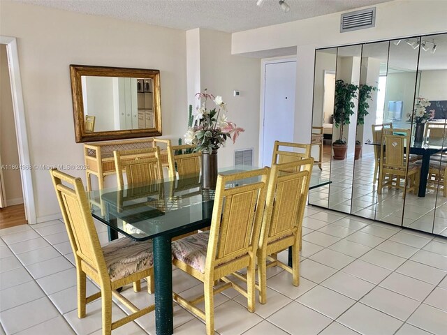 1500 S Ocean Dr Unit 17E, Hollywood, FL 33019 - dining area featuring light tile patterned floors and a textured ceiling