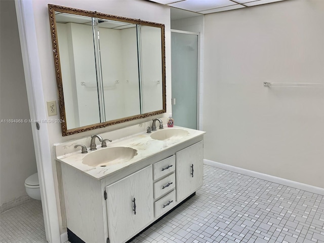 1500 S Ocean Dr Unit 17E, Hollywood, FL 33019 - bathroom with toilet, baseboards, a stall shower, and double vanity