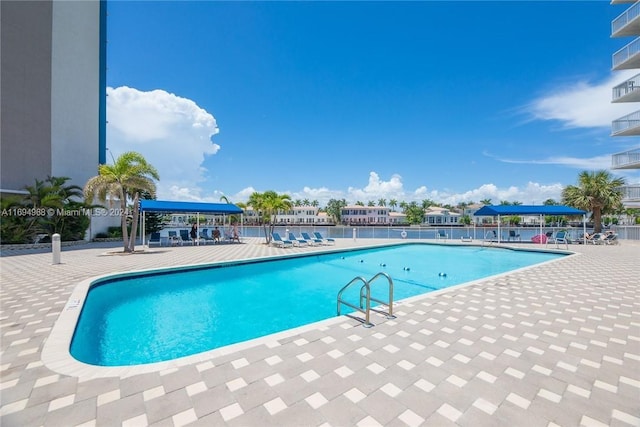 view of swimming pool with a patio area