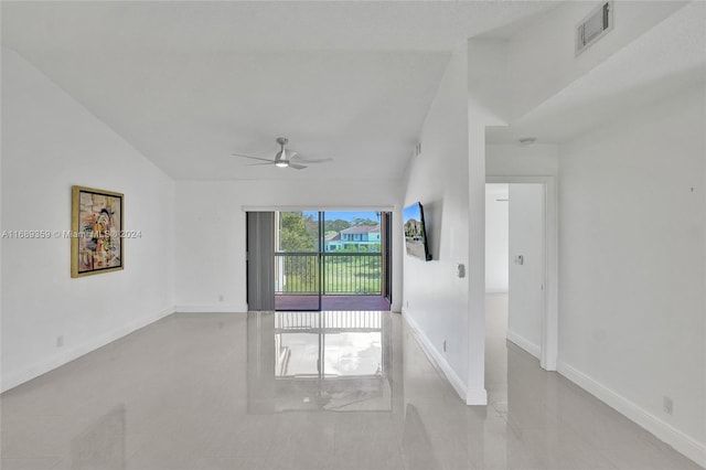 empty room with ceiling fan and lofted ceiling