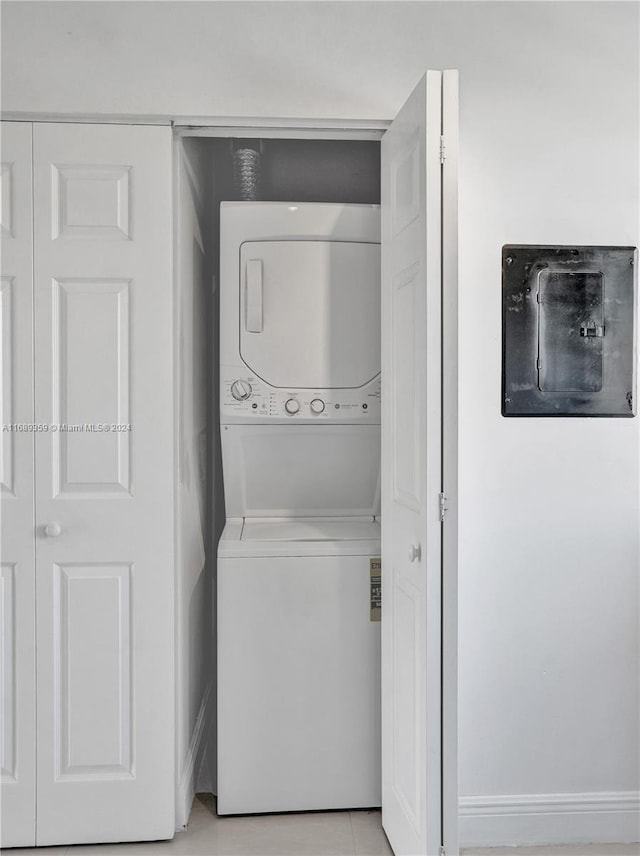 laundry area featuring stacked washer and clothes dryer