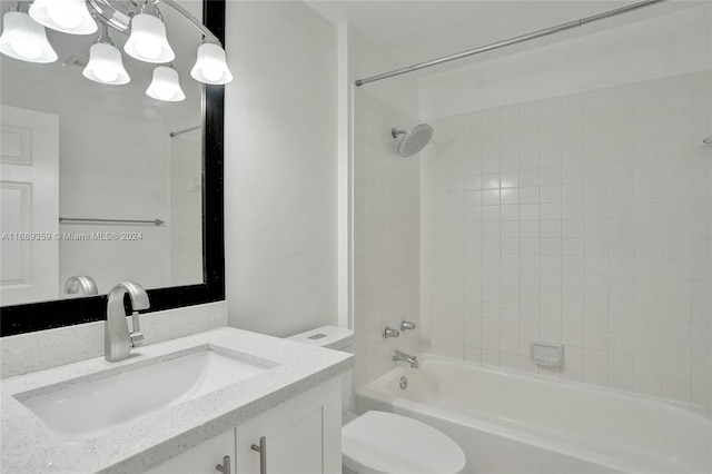 full bathroom featuring vanity, toilet, and tiled shower / bath combo