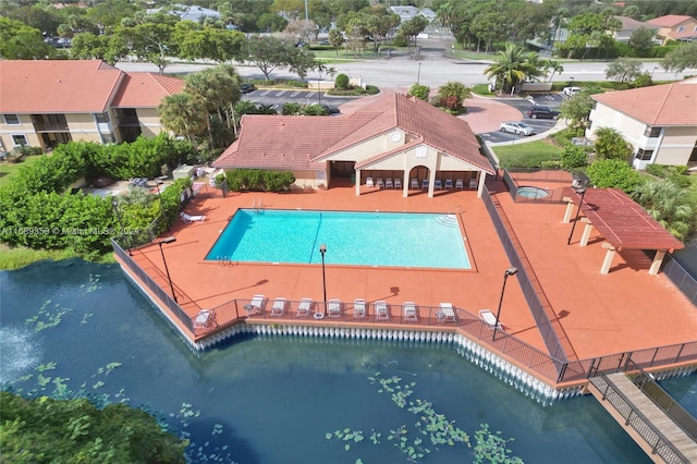 view of swimming pool with a water view