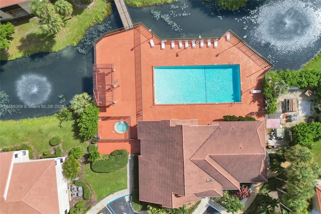 birds eye view of property featuring a water view