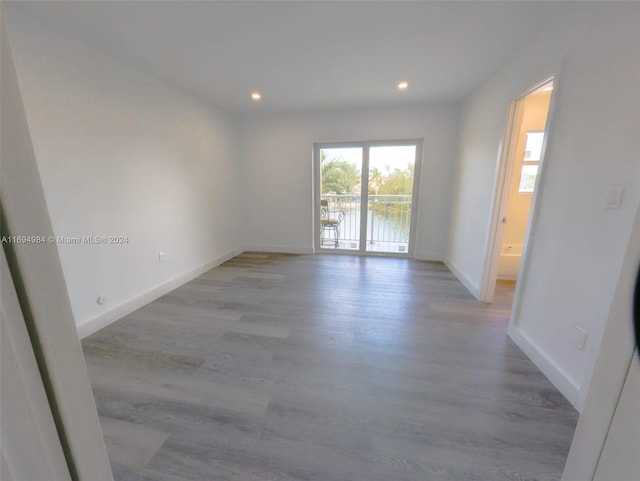 empty room with light hardwood / wood-style floors