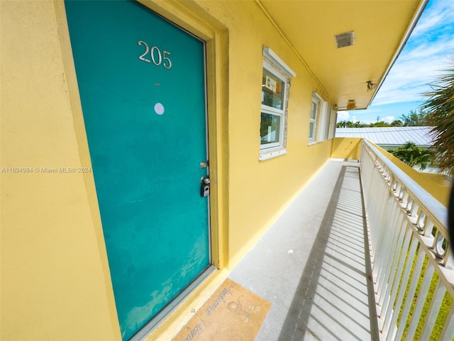 doorway to property with a balcony