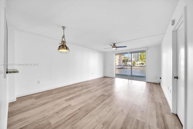 unfurnished room featuring ceiling fan and light wood-type flooring