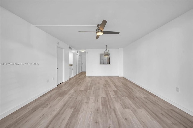 unfurnished living room featuring light wood-type flooring and ceiling fan