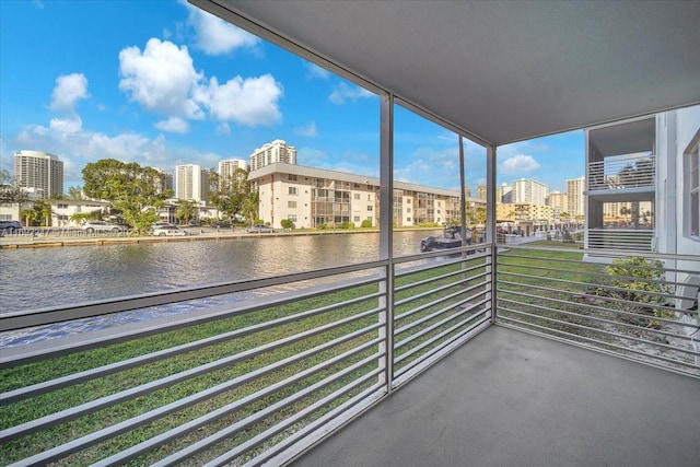 balcony featuring a water view