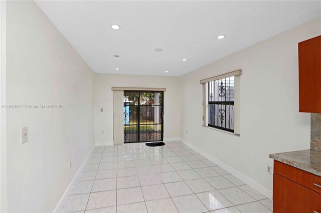 empty room featuring light tile patterned floors