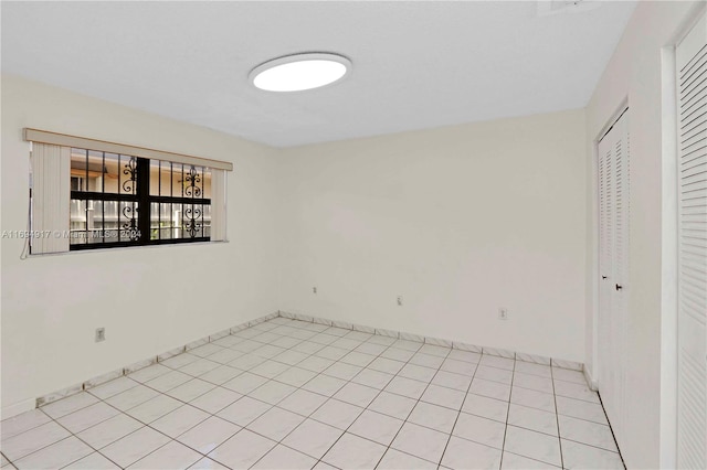 empty room featuring light tile patterned flooring