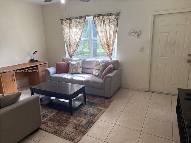 living room featuring ceiling fan and light tile patterned floors