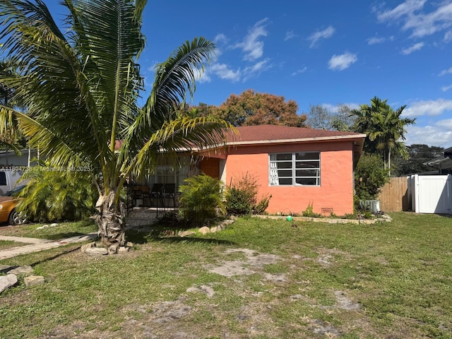 view of property exterior with a yard