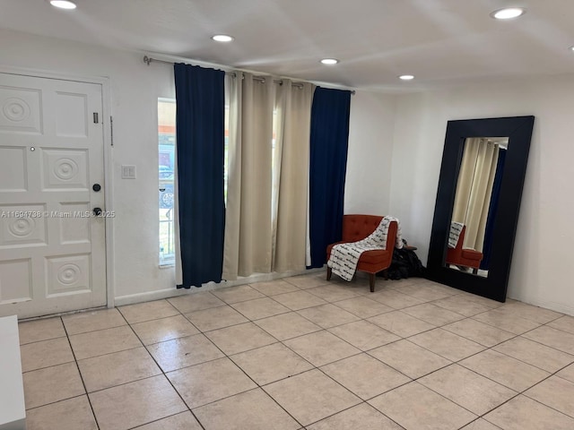 entryway with light tile patterned flooring