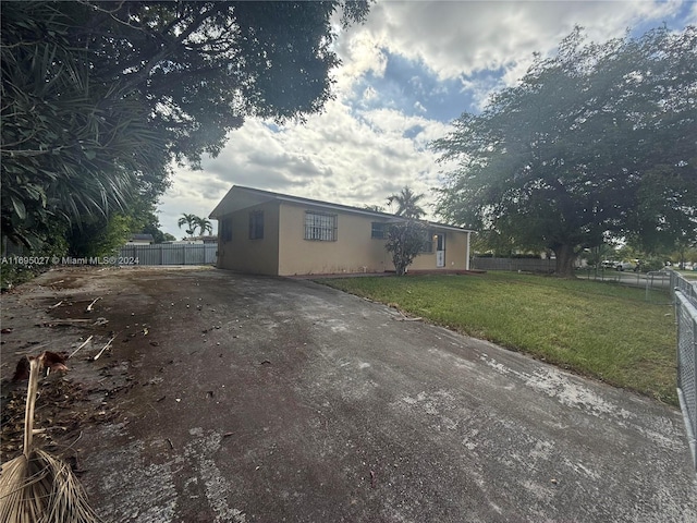 view of home's exterior featuring a lawn