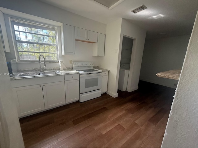 kitchen with sink, white electric range, dark hardwood / wood-style flooring, washer / dryer, and white cabinets