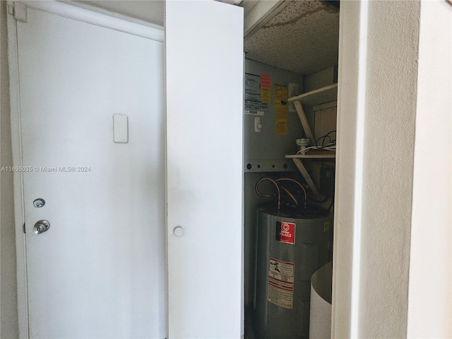 utility room featuring water heater